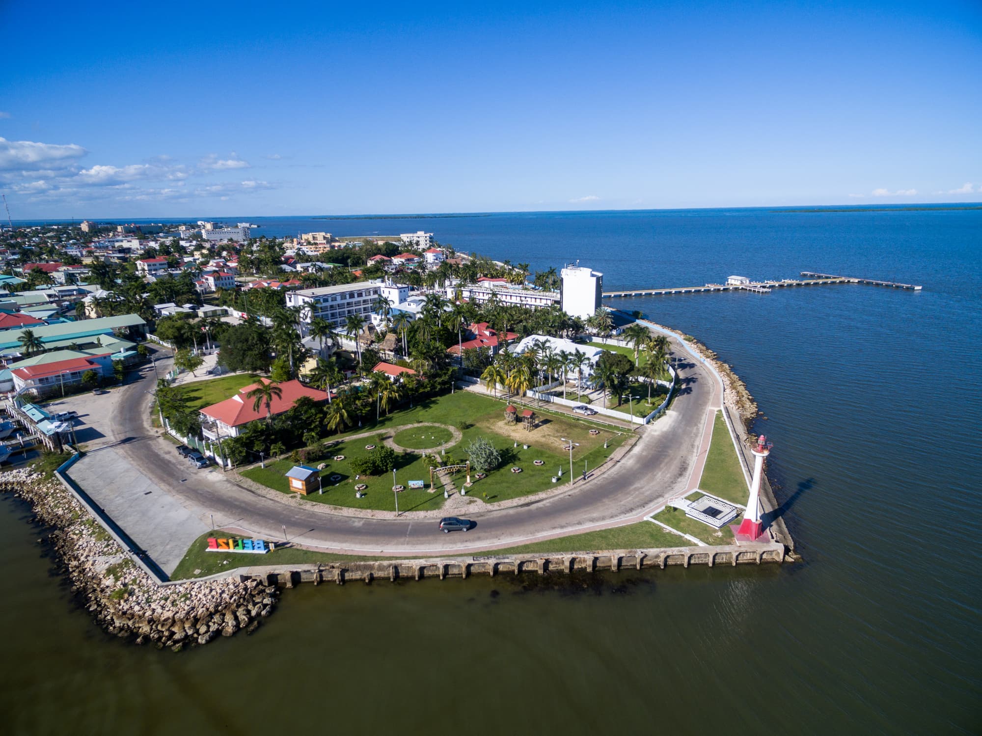 Aerial view of Belize City's coastline and lighthouse on the Caribbean, a hub for Americans in Belize