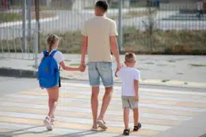 father-and-daughter-with-son-cross-the-pedestrian