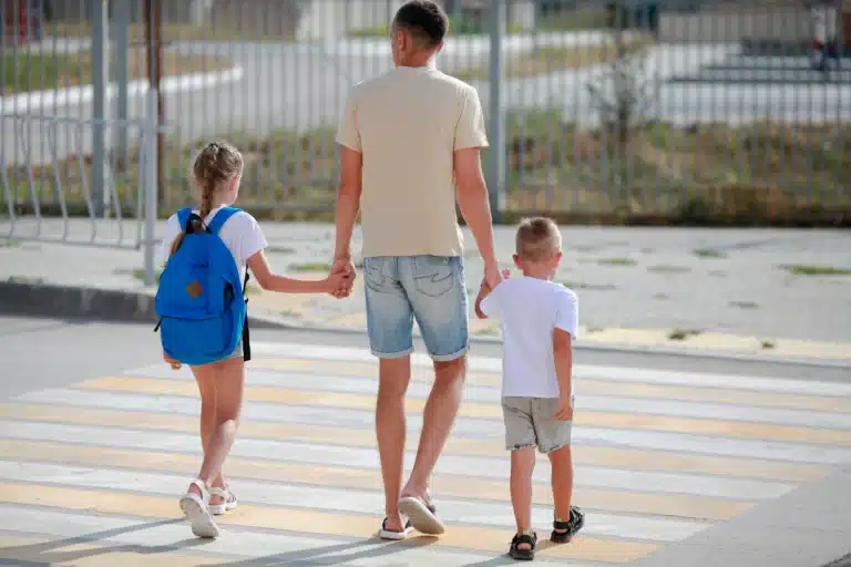 father-and-daughter-with-son-cross-the-pedestrian