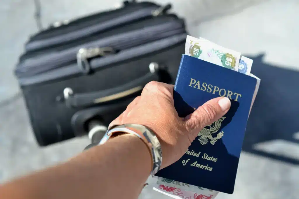 woman holding passport and cash while pulling suit 2025 03 11 18 38 57 utc