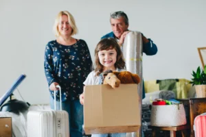 cheerful-family-moving-into-a-new-house-2025-scaled