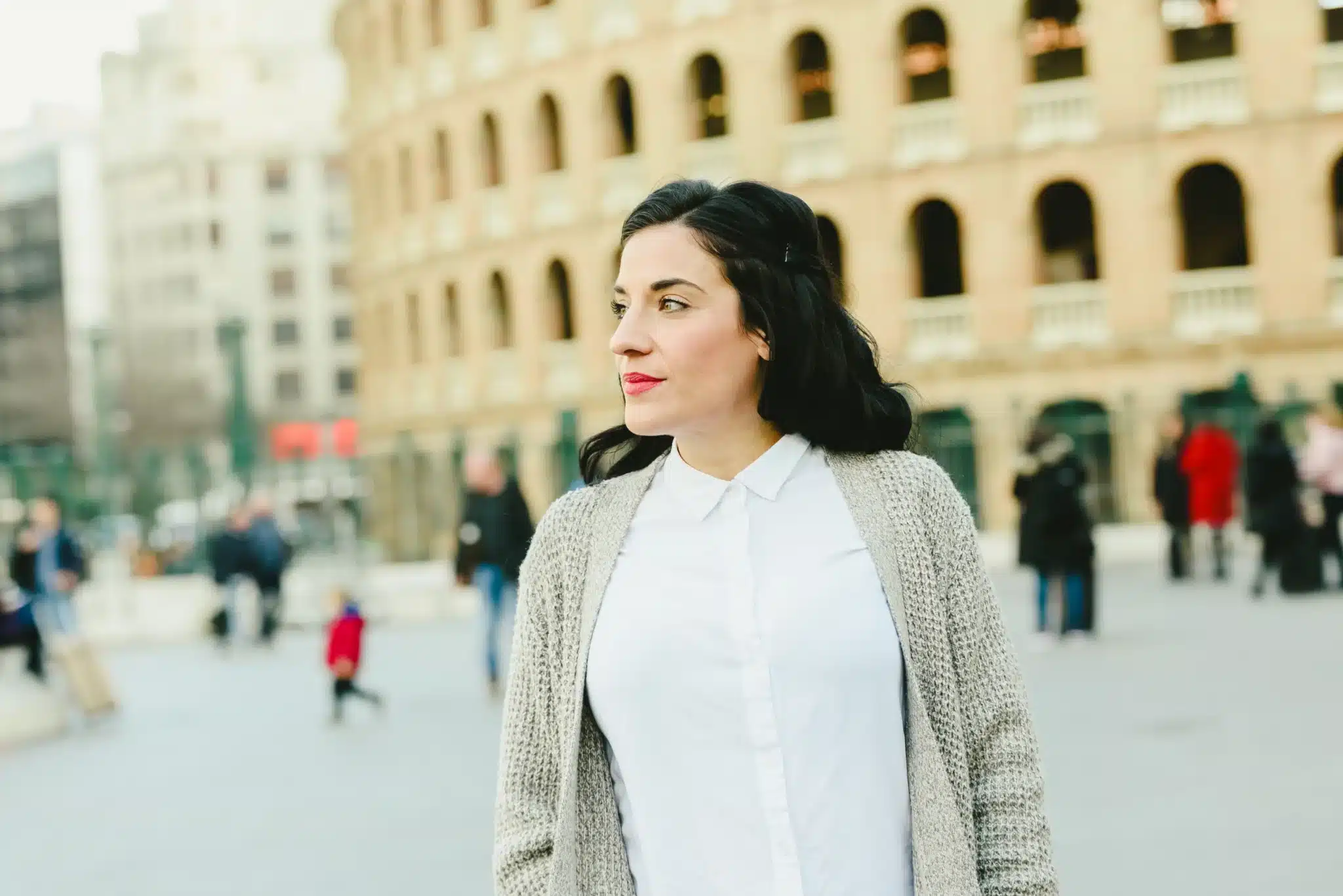 portrait-of-mature-woman-waiting-outside-side-view