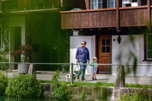 the-man-is-walking-down-the-street-with-his-son