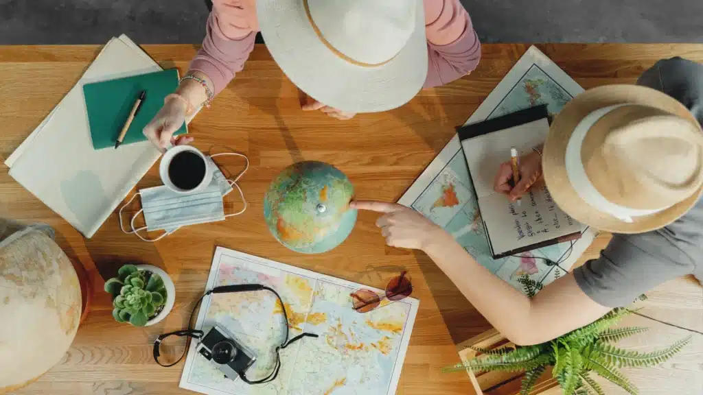 top view of young couple with maps planning vacati 2024 10 21 08 45 46 utc 1