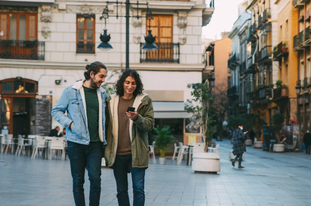 Why Spain Is So Appealing to American Hispanics and LGBTQ+ Communities Fleeing the U.S Amid Unrest 10 young-caucasian-homosexual-couple-walking-on-the-street