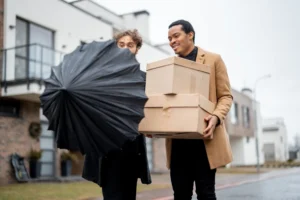 gay-couple-walking-together-with-parcels-outdoors