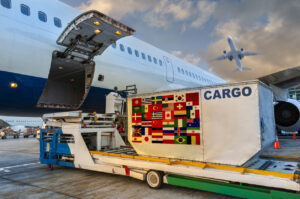 Loading the container with a Many countrie flags in the cargo airplane. Symbolizing the top countries americans are moving to around the world.