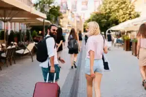 happy-young-tourist-couple-walking-through-europea