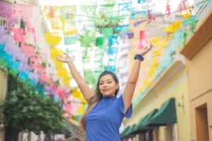 portrait-of-mexican-woman-raising-her-arms