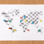 pushpins-on-world-map-on-corkboard