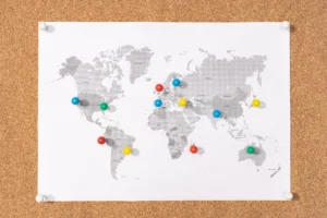 pushpins-on-world-map-on-corkboard