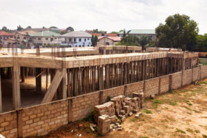 Construction site of an urban housing development in Accra Ghana West Africa, where many black Americans moving to Ghana anticipate building.