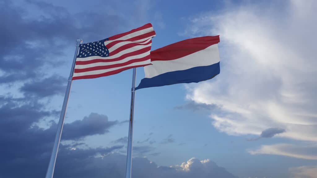 American and Dutch flags flying side-by-side.