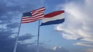 American and Dutch flags flying side-by-side.