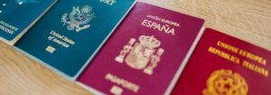 Various passports of citizens of many countries and regions of the world, sympbolizing the rapid rise in Plan B Citizenship