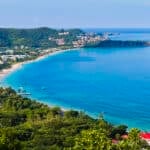 Grand Anse Beach on Grenada's south coast, where Grenada citizenship by investment for Americans draws a small but steady cohort each year.