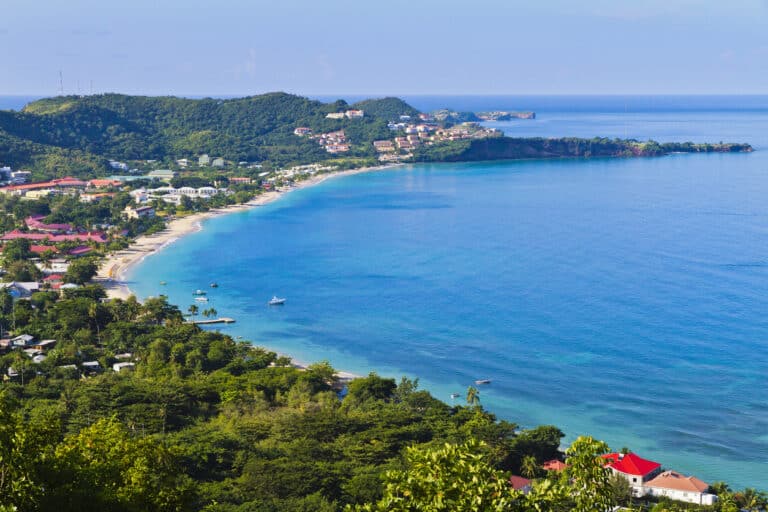 Grand Anse Beach on Grenada's south coast, where Grenada citizenship by investment for Americans draws a small but steady cohort each year.