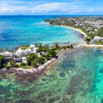 Aerial view of luxury villas along Grand Baie, Mauritius, the kind of development-scheme property open to Mauritius Golden Visa holders.