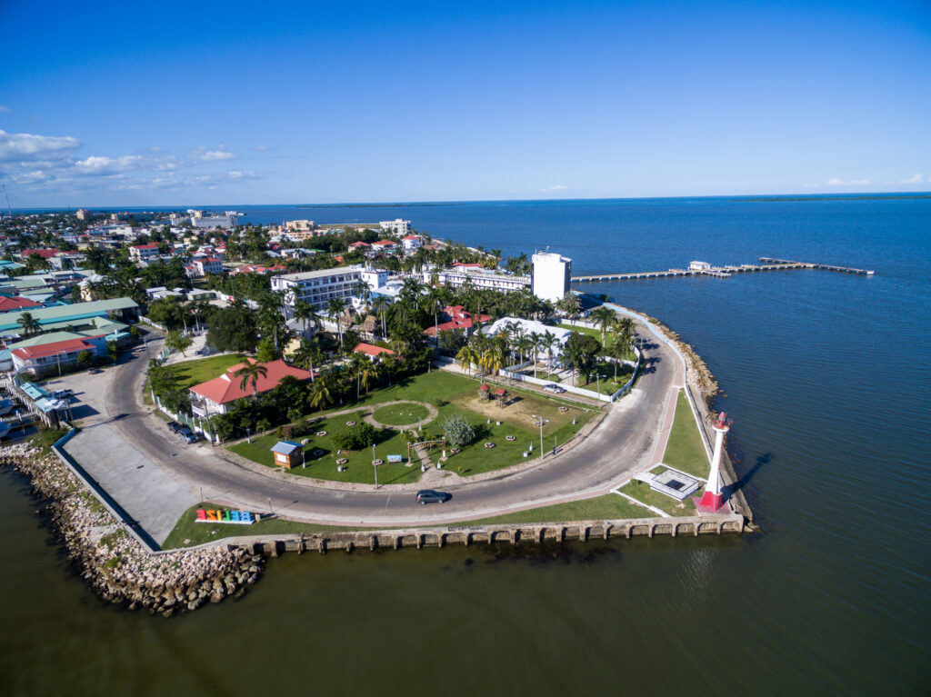 Aerial view of Belize City's coastline and lighthouse on the Caribbean, a hub for Americans in Belize