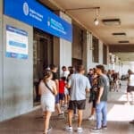 People wait in line outside Argentina's Registro Nacional de las Personas office in Buenos Aires, where foreign residents process paperwork affected by the Argentina naturalization rules