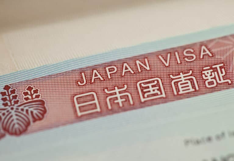 Close-up of a Japan visa label in a passport, illustrating Japan's permanent residency fee increase