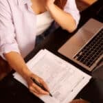 An American abroad preparing taxes while hoping for residence-based taxation soon.